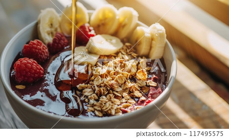 Nutritious acai bowl with honey and morning sun: copy space 117495575