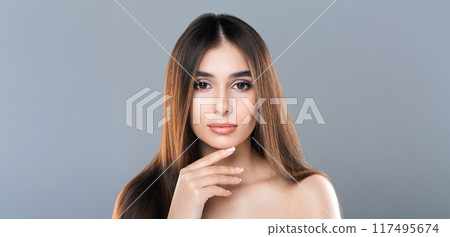 Fashion portrait of young beautiful half-naked woman with perfect skin posing on grey background, free space 117495674