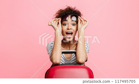 Travel and lifestyle. Surprised girl looking at camera over pink background Travel and lifestyle. Surprised girl looking at camera over pink background 117495705