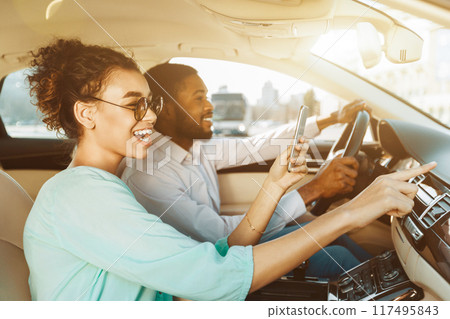 Travel Together. African American Couple Using Navigator System, Driving Car 117495843