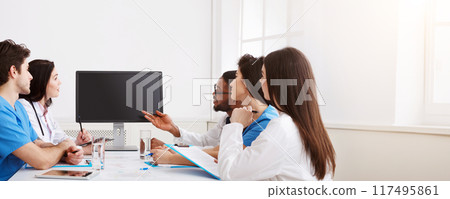 Remote Medicine. Team of Doctors Parsing Difficult Case From Patient By Video Link 117495861