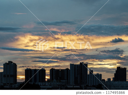 Silhouette view of Modern high-rise buildings and background of Dramatic sky in the city of Bangkok. Silhouette view of Modern high-rise buildings and background of Dramatic sky in the city of Bangkok. 117495866