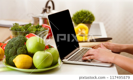 Food Blogger Writing New Post, Fruits Near Laptop Computer With Blank Screen 117495879