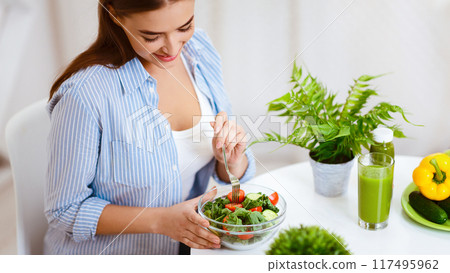 Healthy Dinner. Woman Eating Vegetable Salad At Home Kitchen, Crop 117495962