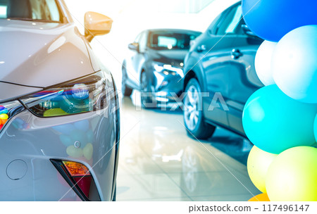 Car parked in luxury showroom. Car dealership office. Car showroom business. New car parked in modern showroom. Auto for sale and rent business. Automobile leasing and insurance. Electric automobile. 117496147