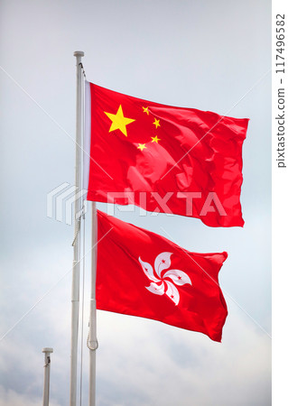 The Chinese flag (five-star red flag, above) and the flag of the Hong Kong Special Administrative Region featuring a Bauhinia flower design The Chinese flag (five-star red flag, above) and the flag of the Hong Kong Special Administrative Region featuring a Bauhinia flower design 117496582