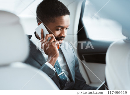 Business Trip. African American Man Talking On Phone And Discussing Work, Sitting In Car 117496619