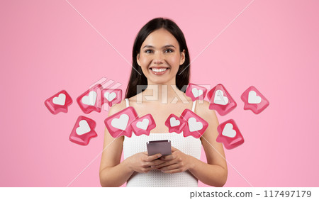 A smiling European lady in a summer setting poised to have a live chat on dating app, representing generation z, isolated against a pink background 117497179