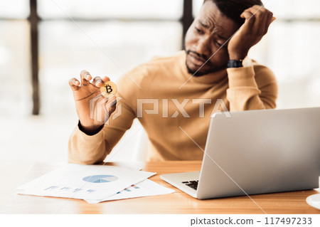 Cryptocurrency Crash. Sad afro businessman in despair, bitcoin value price fall. Empty space 117497233