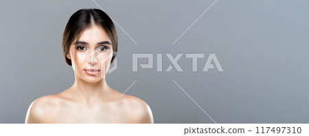 A woman without a shirt on is striking a pose while being photographed. She is confidently showcasing her figure in a bold manner, copy space, web-banner A woman without a shirt on is striking a pose while being photographed. She is confidently showcasing her figure in a bold manner, copy space, web-banner 117497310