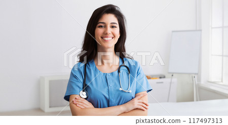 Happy Intern With Crossed Arms Looking At Camera During Conference In Meeting Room Happy Intern With Crossed Arms Looking At Camera During Conference In Meeting Room 117497313