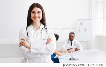 Love My Job. Happy Practitioner At Medical Conference Smiling To Camera In Meeting Room, Empty Space 117497491