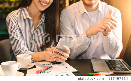 Mobile application development. Cheerful woman enjoying demo version of new project, business meeting in cafe, empty space Mobile application development. Cheerful woman enjoying demo version of new project, business meeting in cafe, empty space 117497514