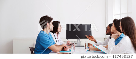 Remote Medicine. Team of Doctors Parsing Difficult Case From Patient By Video Link Remote Medicine. Team of Doctors Parsing Difficult Case From Patient By Video Link 117498127