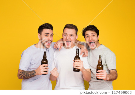 Smiling European men with beers celebrate, showcasing a strong bond of friendship and camaraderie among mates Smiling European men with beers celebrate, showcasing a strong bond of friendship and camaraderie among mates 117499063