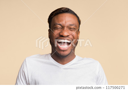 Portrait Of Laughing Black Man Standing Over Yellow Background. Sense Of Humor Concept. Studio Shot 117500271