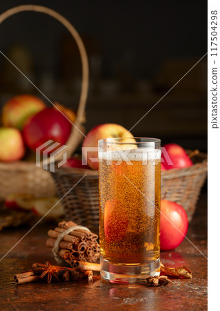 Apple cider with fresh apples, cinnamon, and anise. Apple cider with fresh apples, cinnamon, and anise. 117504298