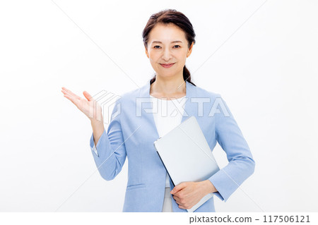 Woman operating a personal computer 117506121