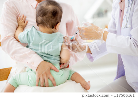 Baby receiving medical examination Vaccination 117506161