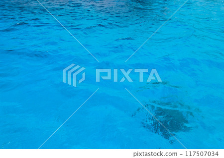 Blue water texture background. Surface of sea or ocean Blue water texture background. Surface of sea or ocean 117507034