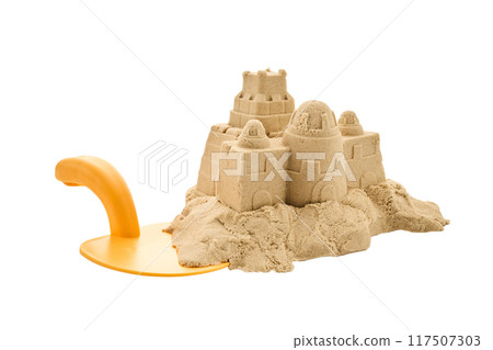 Sandcastle with Toy Shovel on white background Sandcastle with Toy Shovel on white background 117507303