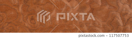 Swirls of auburn and cinnamon on a polished veneer wood surface Swirls of auburn and cinnamon on a polished veneer wood surface 117507753