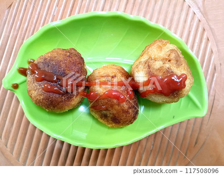 Potato croquettes - mashed potatoes balls breaded and deep fried 117508096