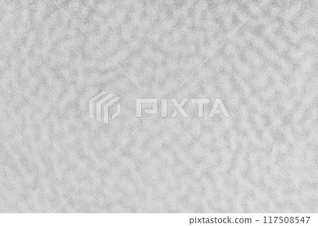 Faux fur texture with wavy effect, fluffy velours white fabric or cloth, upholstery textile 117508547