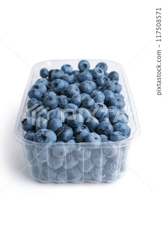 Fresh raw organic blueberries in transparent plastic container isolated on white background 117508571