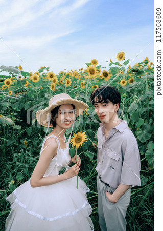 Couple dancing in a sunflower field 117508609