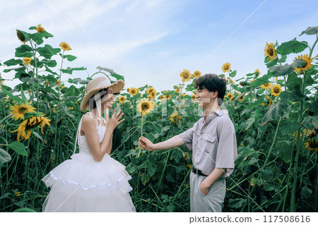 Couple dancing in a sunflower field 117508616