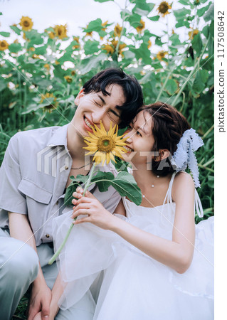 Couple dancing in a sunflower field 117508642