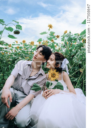 Couple dancing in a sunflower field Couple dancing in a sunflower field 117508647