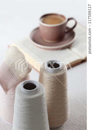 Cotton yarn. Yarn of warm tones for needlework. Knitting is like a hobby. The scheme for knitting. Light background. Cotton yarn. Yarn of warm tones for needlework. Knitting is like a hobby. The scheme for knitting. Light background. 117509117