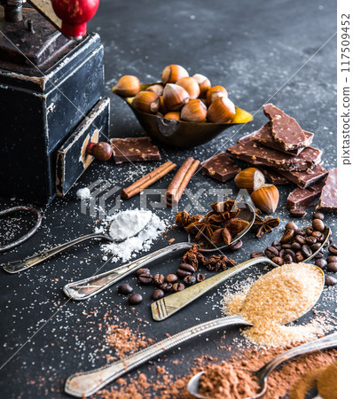 Sweet spices and chocolate on a table Sweet spices and chocolate on a table 117509452