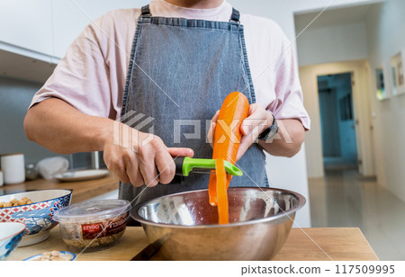 Chef at the kitchen preparing massaman curry with sweet potato and many spices Chef at the kitchen preparing massaman curry with sweet potato and many spices 117509995