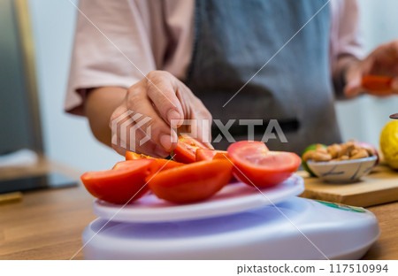 Chef at the kitchen preparing spicy glass noodle salad Chef at the kitchen preparing spicy glass noodle salad 117510994