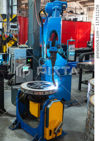 Automatic Industrial welding robot in a modern factory Automatic Industrial welding robot in a modern factory 117511256