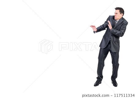 Disgusted man in elegant suit. White background. Disgusted man in elegant suit. White background. 117511334