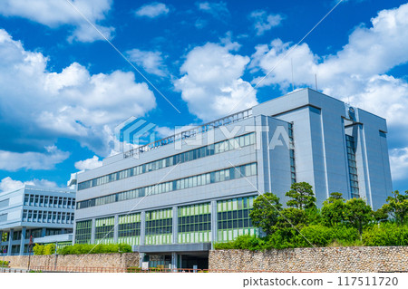 Ashiya City Hall building shining against the blue midsummer sky in Ashiya City, Hyogo Prefecture 117511720