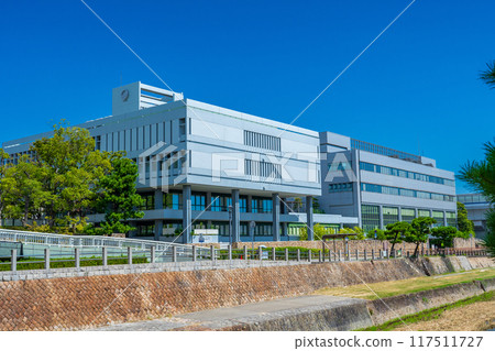 Ashiya City Hall building shining against the blue midsummer sky in Ashiya City, Hyogo Prefecture 117511727