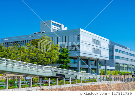 Ashiya City Hall building shining against the blue midsummer sky in Ashiya City, Hyogo Prefecture 117511729