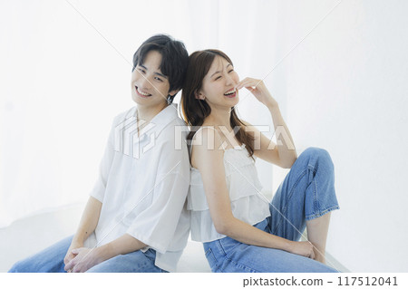 A couple wearing matching denim outfits A couple wearing matching denim outfits 117512041