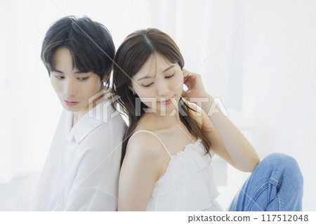 A couple wearing matching denim outfits 117512048