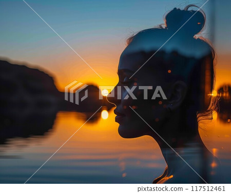 Silhouette woman profile sunset water blending nature double exposure 117512461