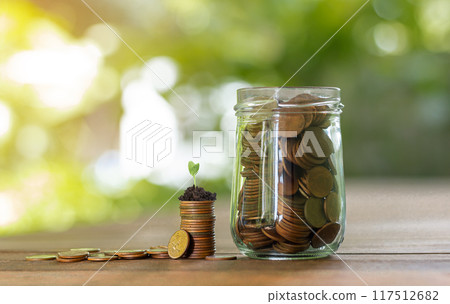 Growing money, Growth saving money and bank account for finance concept, Bottle with coins Growing money, Growth saving money and bank account for finance concept, Bottle with coins 117512682