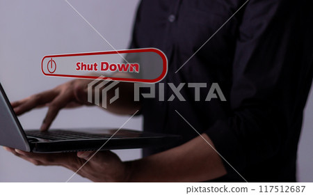 Young man hand touching laptop Shut Down button press power OFF Young man hand touching laptop Shut Down button press power OFF 117512687