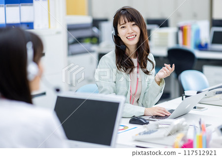 Image of a woman working in a call center Image of a woman working in a call center 117512921