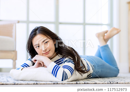 Woman living alone prone 117512973