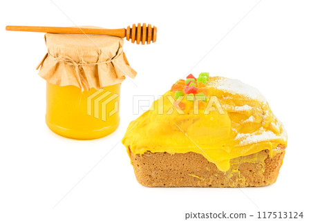 Honey cake and jar of honey isolated on white. Collage. Honey cake and jar of honey isolated on white. Collage. 117513124